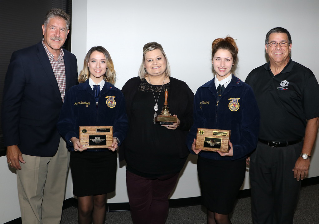  Randal O’Brien (left), Goose Creek CISD superintendent, and Al Richard (right), Goose Creek CISD board president, recognize Jordan Gwaltney (second from left) and Kylie Gwaltney (second from right), Goose Creek Memorial High School students, for being awarded Lone Star Degrees at the 89th Texas State FFA Convention.  