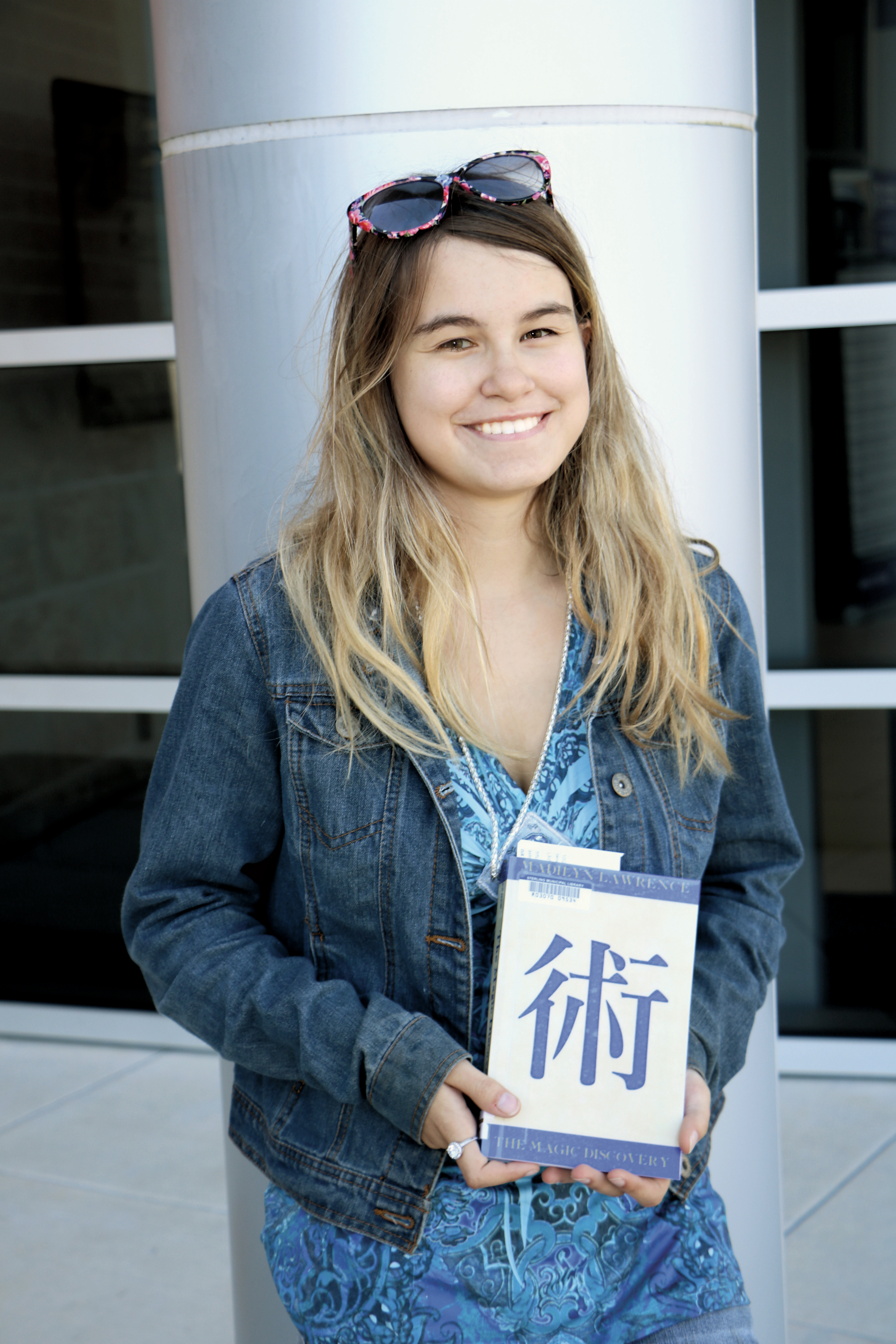  Photo of Maddie Lawrence. Maddie Lawrence, a junior at IMPACT Early College High School, is following up her first novel with a sequel. 