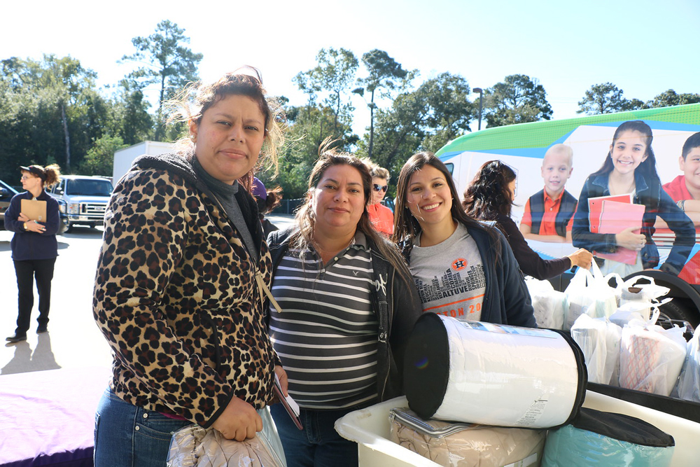  Crisalba Castrejon (left) from Gentry Junior School, and Francisca Villalobos (middle) from Cedar Bayou Junior School pick out blankets and comforters with Erika Foster, Goose Creek Education Foundation director, to go with the mattresses provided by Chevron Phillips Chemical Co. Both have children in Goose Creek CISD schools. 