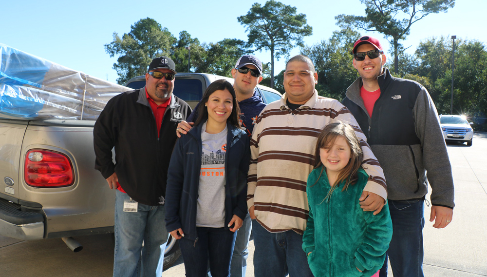  David Bautista (second from right) and Gaelyn Sherman (right front), are grateful for the mattress they will take home for Gaelyn’s sister Addison Bautista. Also pictured are (from left) Rafael Cantu, GCCISD Warehouse supervisor; Erika Foster, GCCISD Education Foundation director; Ryan Foster from Envasco and Jon Howerton from Mattress Firm.
