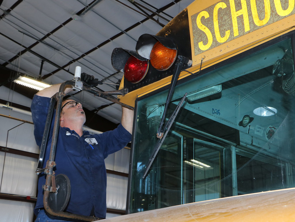 
Mechanic works on school bus
