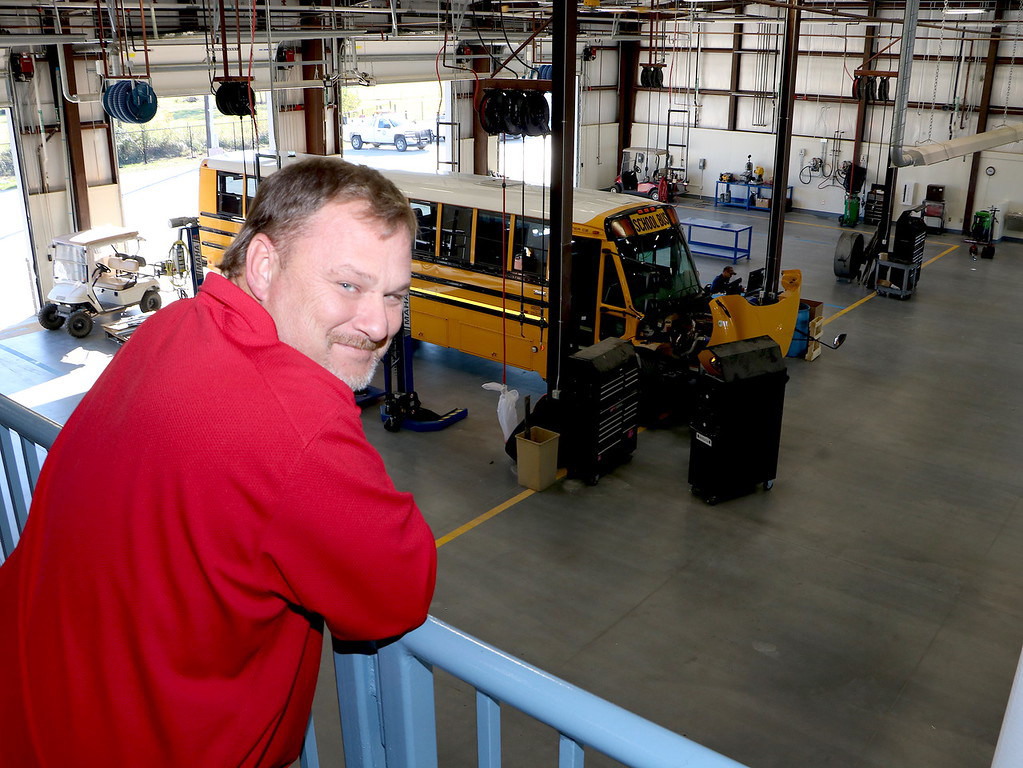 Transportation director overlooks mechanics garage