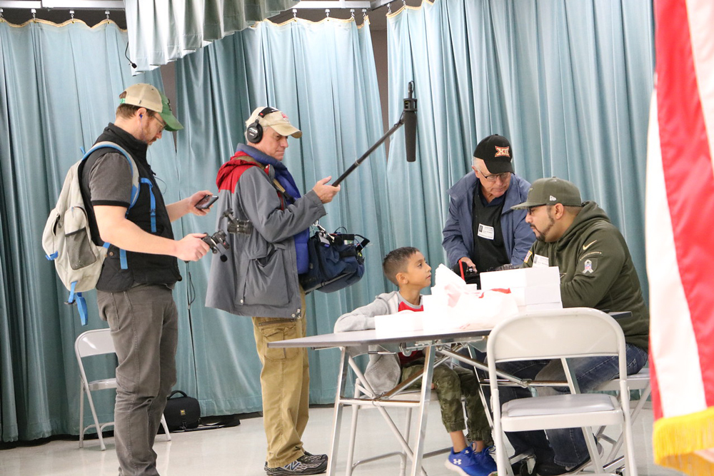 
ESPN visits Stephen F. Austin Elementary as Kevin Martinez (right) has lunch with his son Matthew on his eighth birthday.  ESPN is producing “We the Fans/Dallas Cowboys,” a documentary about the lives of Dallas Cowboys season ticket holders, and Martinez was selected as a major fan.  The crew has been following him to Cowboys games as well as through his daily life, which included bringing lunch for Matthew and cookies for his class. Also pictured are (from left) Alex Wheat from ESPN and James Bowen and Robert Porter from Texas Crew Production. The documentary will air in April 2018.
