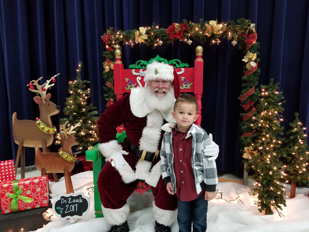 
Bentley Aguilar, pre-kindergarten student, enjoys talking to Santa Claus when he visited De Zavala Elementary on a magical snowy day.
