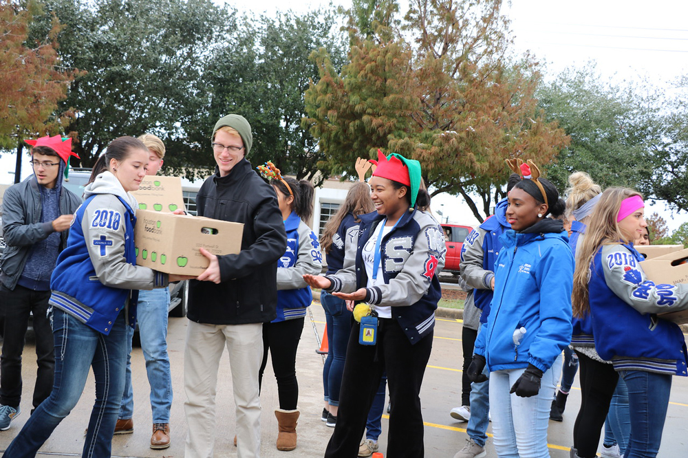 
Gauge Herrera, Melynn Fleetwood, Reece Brown, Andrew Beck, Raelynn Polina, Trenity Arceneaux, Angel McKnight and Victoria Foster, Peer Assistance and Leadership (PAL) students at Ross S. Sterling High School, unload donations of food items from the community Friday morning for the Channel 13 Share Your Holidays Food Drive. The community has participated in the drive for the past 37 years. PALs are sponsored by Beth Woods.
