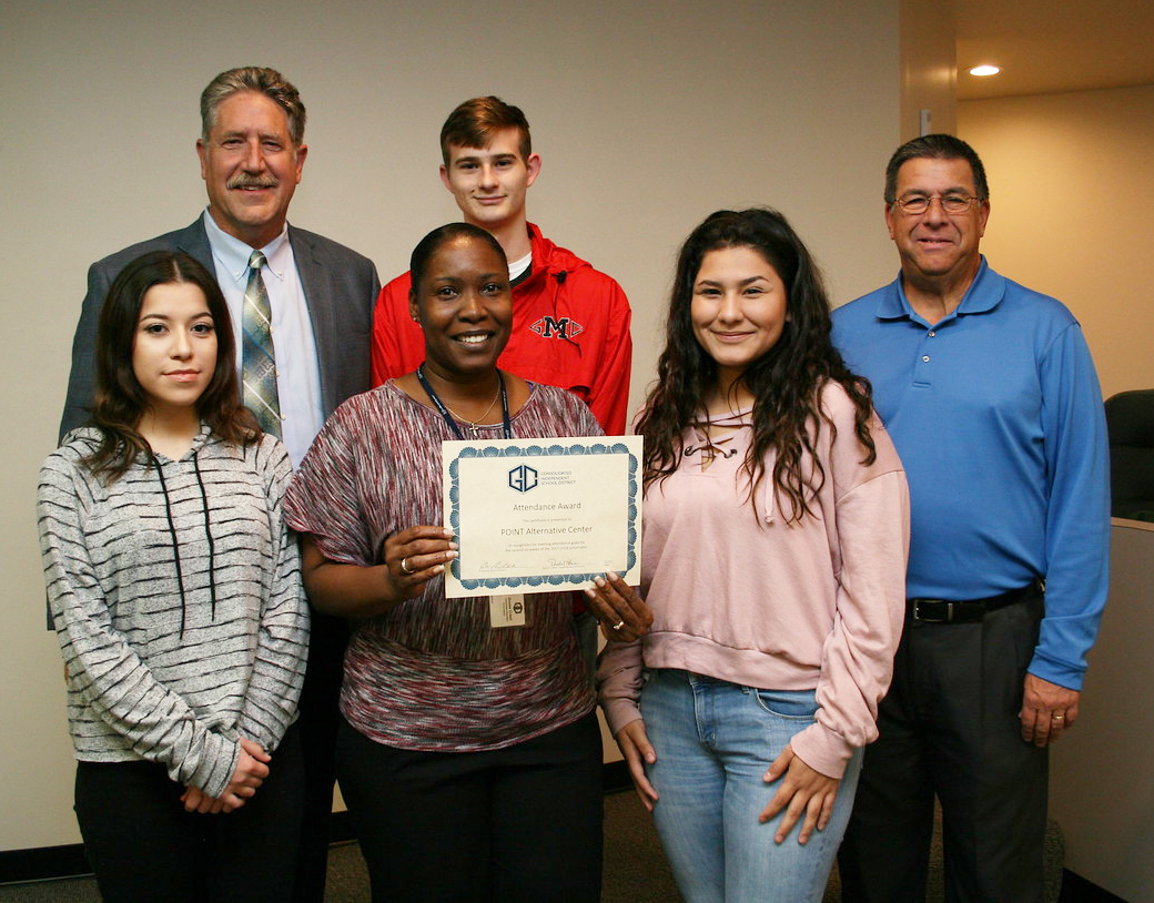 
POINT Alternative Center is recognized for meeting its attendance goal, with an 82.56 percent attendance rate for the second six weeks, at a recent meeting of the GCCISD board of trustees. Pictured  are (front, from left) Tiffany Stanley; Tricia Times, principal; Miranda Doyle; (back, from left) Randal O’Brien, Goose Creek CISD superintendent; Blayne Williams and Al Richard, GCCISD board president.
