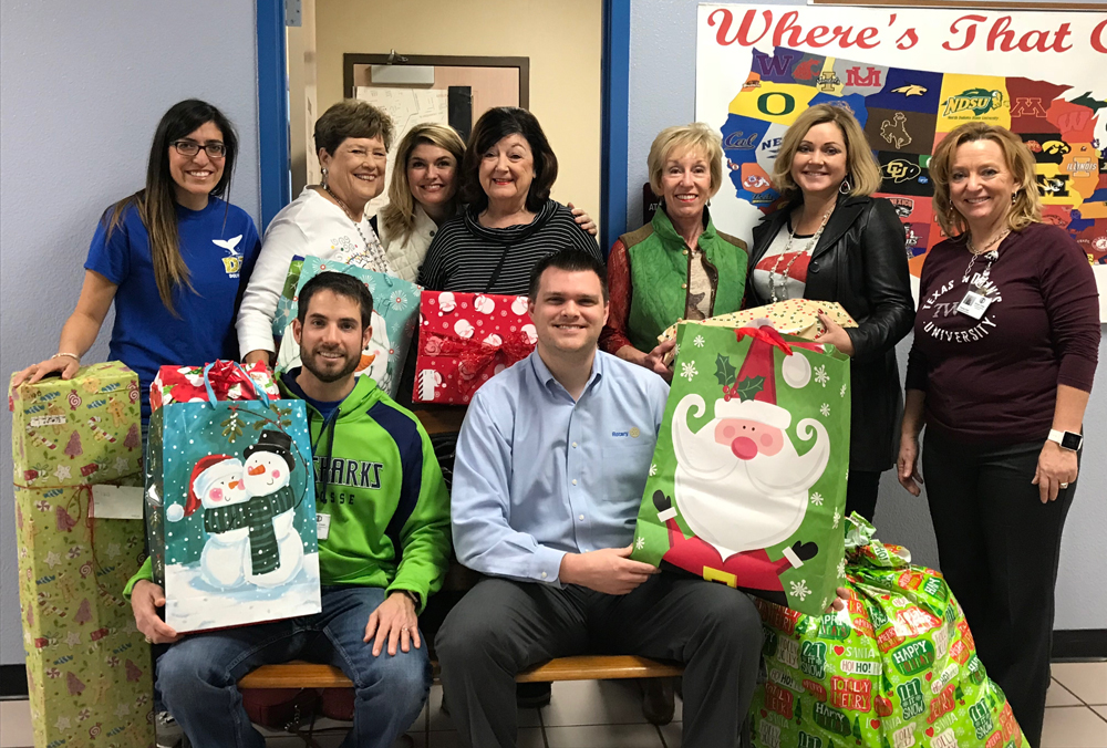 
The Rotary Club of Baytown brings Christmas gifts for some families at De Zavala Elementary. Pictured are (front, from left) Philip McAdam; Nick Woolery, president of Rotary Club of Baytown, (back, from left) Leah Abbate, assistant principal at De Zavala; Sandra Bell; Rebecca Estrada, De Zavala counselor; Kathy Clausen, Sonya Cather, and Sheila Crawford.
