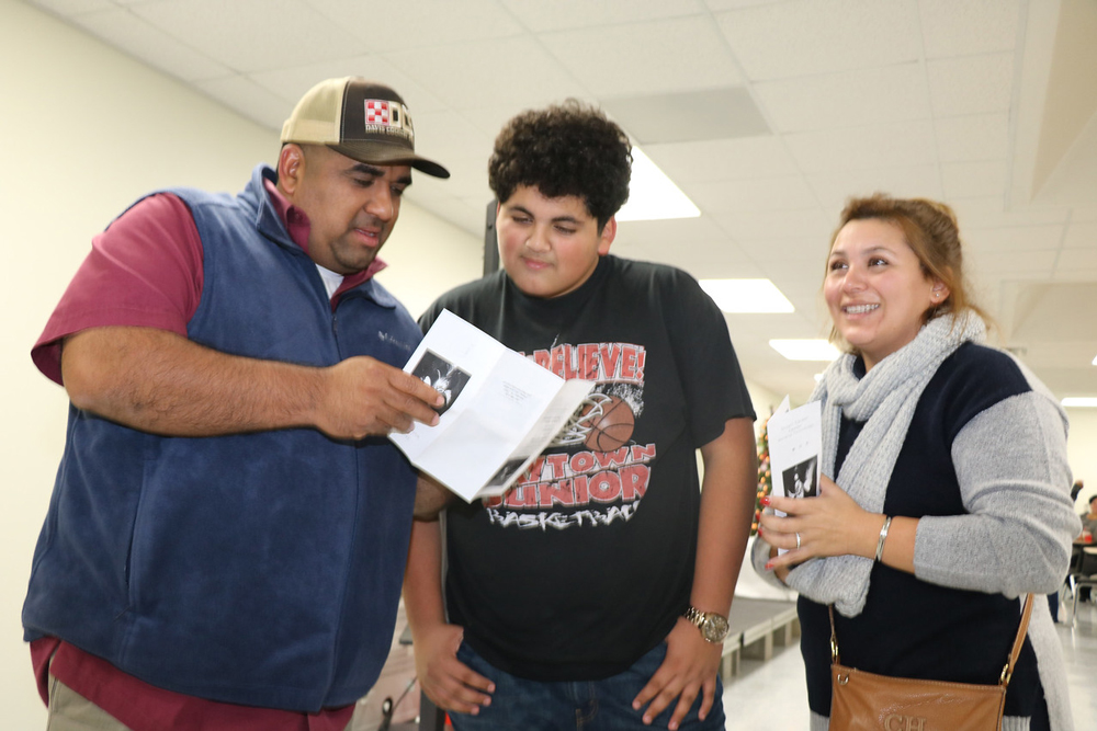 
Omar Nieto (middle), an eighth-grade student at Baytown Junior School, discusses Welding with his parents Paulo Nieto (left) and Abigail Nieto during the Stuart Career Tech High School Student Showcase. Students and parents saw demonstrations and received information from
