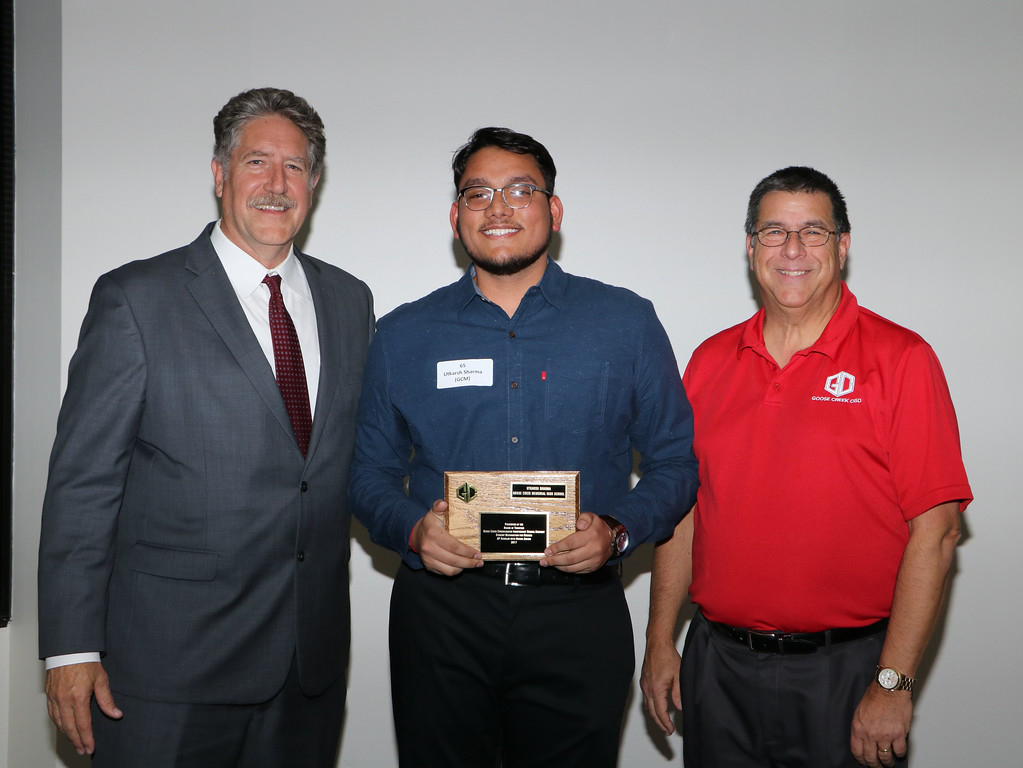 
Utkarsh Sharma from Goose Creek Memorial High School (middle) is congratulated by Randal O’Brien, GCCISD superintendent (left) and Al Richard, GCCISD board president, as an AP Scholar with Honor for scoring a 3 or higher on 10 exams.
Not pictured is Shade’ Flavien.
