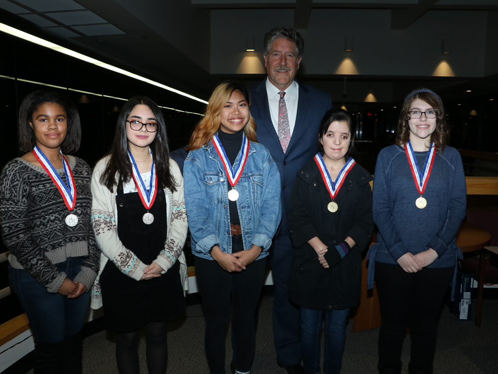 
Randal O’Brien (back), Goose Creek CISD superintendent, congratulates Houston Livestock Show and Rodeo School Art Contest High School Special Merit Medalists (from left) Paris Landry, 12th grade, Ross S. Sterling High School, art teacher Annie Watson; Larissa Solis, 12th grade, RSS, art teacher Annie Watson; Erin Ouano, 11th grade, Goose Creek Memorial, art teacher Johnna Morris, and High School Gold Medal Winners Marisa Gates, 12th; grade, GCM, art teacher Johnna Morris and Skylar Newton, 10th grade, GCM, art teacher Johnna Morris.
