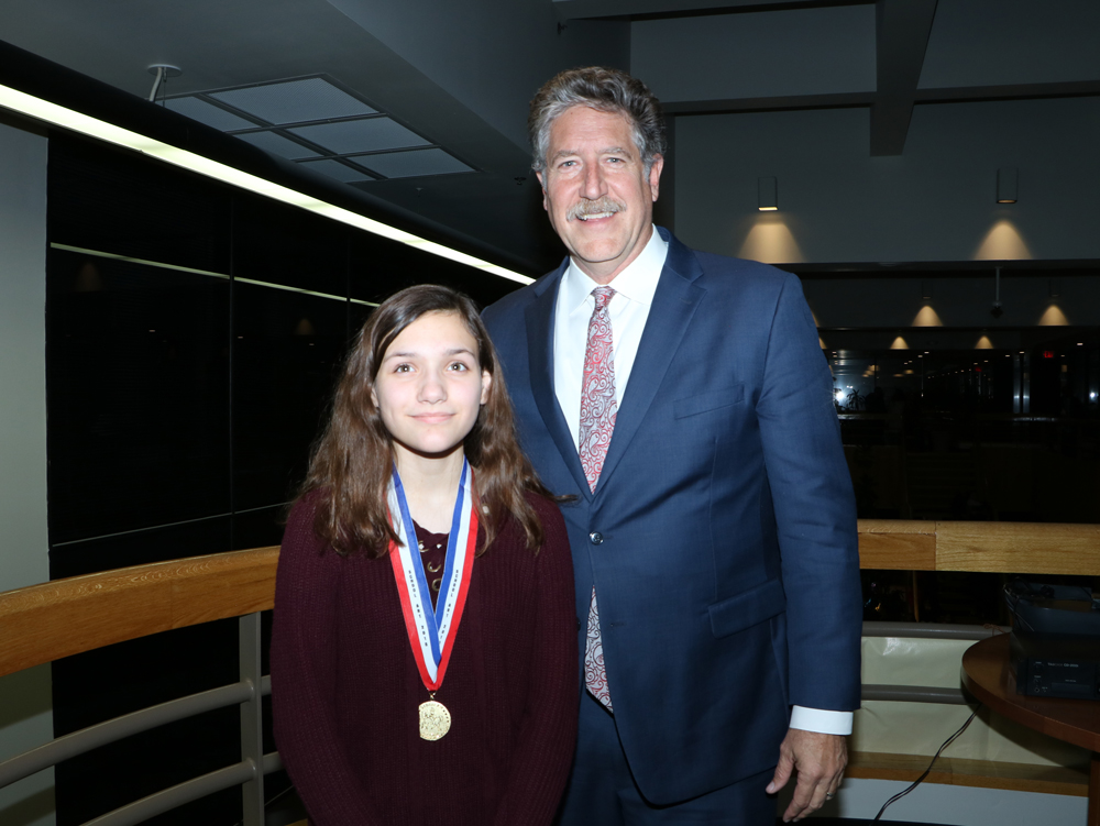 
Lauren Mudd, eighth-grader at Gentry Junior School, is congratulated by Randal O’Brien, Goose Creek CISD superintendent, for receiving the Junior School Gold Medal in the Houston Livestock Show and Rodeo School Art Contest. Lauren is under the direction of art teacher Jennifer Martin.
