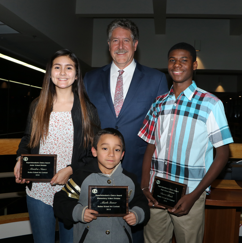 
The Superintendent’s Award, a new category in the Goose Creek CISD local Rodeo Art Contest, went to (from left) Alondra Nunez, Gentry Junior School, teacher Jennifer Martin; Mark Stoner, Bowie Elementary, teacher Tina Pequeno and Daron Bush, Goose Creek Memorial High School, teacher Brandi Aguilar. The students are congratulated by Randal O’Brien, Goose Creek CISD superintendent, who selected the winning art.
