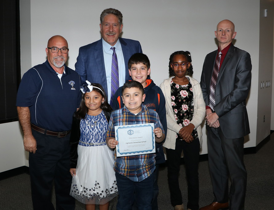 
Randal O’Brien (back), Goose Creek CISD superintendent, and Pete Pape (right), board president, congratulate (front, from left) Edward Villanueva, Highlands Elementary principal, and students Giselle Valdovinos, third grade; Bert Dillow, second grade; Hank Barrientes, fourth grade and Amber Joseph, fifth grade, for having the highest elementary attendance percentage, 95.99 percent, for the third six weeks.
