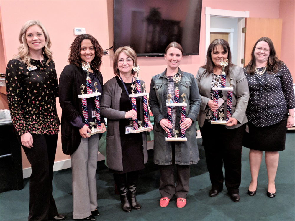 
Macie Schubert (left), Community Resource Credit Union and Partner In Education chair, presents trophies to (from left) Laura Hernandez from Ross S. Sterling High School for Most Collected Cards – High School (3,453), Maria Rosas from B. P. Hopper Primary for Most Creative Cards, Areasha Herbert from Horace Mann Junior School for Most Collected Cards – Junior School (2,039) and Terry Coy  and Rachel McAdam from San Jacinto Elementary for Most Collected Cards – Elementary (21,072). The Chamber delivered 31,200 cards to HOME in November that were distributed to all branches of the military in Japan, Kuwait, Germany, South Korea, Iraq and Afghanistan.
