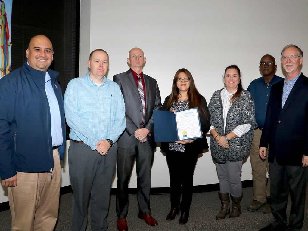 
Laura Alvarado, mayor pro tem, presents the Goose Creek CISD Board of Trustees with a Proclamation from the City of Baytown in honor of School Board Recognition Month. Pictured with Alvarado are (from left) board members
Agustin Loredo III, vice president; Ben Pape; Pete Pape, president; Jessica Woods, secretary; Howard Sampson, assistant secretary, and Ricky Clem. Not pictured is Al Richard.
