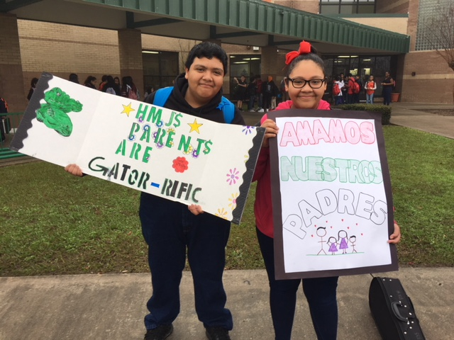 
Joel Salazar and Noemi Salazar, students at Horace Mann Junior School, greet parents on Valentine’s day with signs from the students and staff showing appreciation. The administrative team and counselors gave out bags of doughnut holes to parents as they dropped their students off for school.
