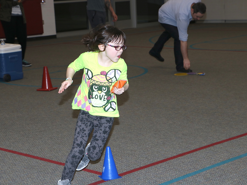 
Running around obstacles is easy for Gabby Russell, a second-grader at Alamo Elementary, as she enjoys Alamo Fitness Frenzy. Sponsored by the Baytown YMCA and Aramark, the event allowed parents and students to participate in fitness activities, enjoy healthy snacks and exercise their brains by reading. Ester Morales, Alamo’s campus student success specialist, organized the fitness night.
