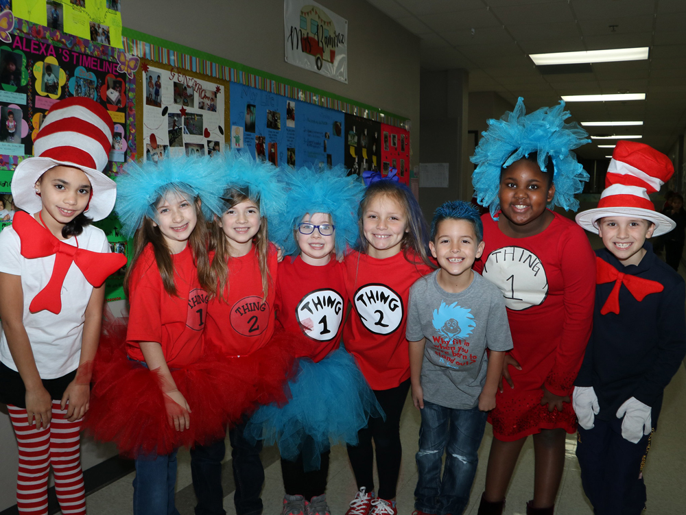 
Austin Elementary students (from left) Camila Carrero, Taryn Langston, Matison Langston, Ainsley Benort, Emery Walker, Lucas Findlay, Amaya Russell, and Bradley Chance show off their attire for
Dr. Seuss’ birthday.
