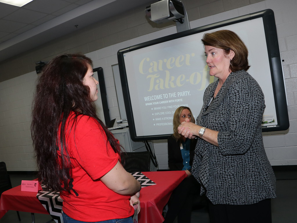  Evann Corr (left), a senior, discusses her career plans with Kathy Young, owner of Merle Norman of Baytown. Young was one of the panelists at the Women in Business Forum, presented by Forté Foundation, held at Goose Creek Memorial High School.
