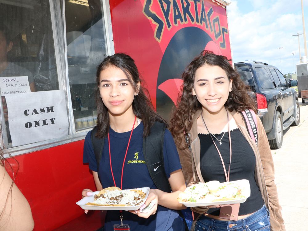  ninth-graders at Goose Creek Memorial High School, enjoy purchasing lunch from a food truck Friday. 