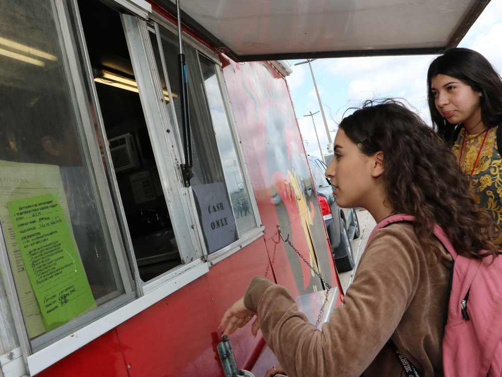  ninth-grader at Goose Creek Memorial High School, enjoy purchases lunch from a food truck  