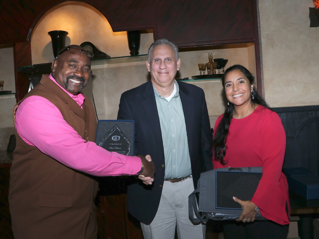  Dr. Price congratulates two other people