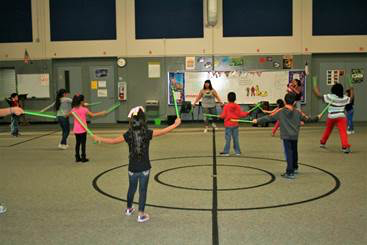  Pound (workout) instructor Momo Foster with the City of Baytown leads students in routines at Lamar CATCH Night.
