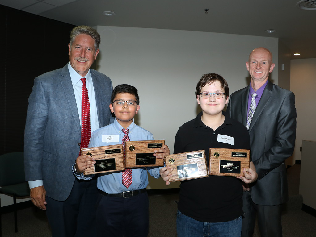 
Randal O’Brien (left), Goose Creek CISD superintendent, and Pete Pape (right), president of the board of trustees, congratulate Arin Sood (second from left) and Hunter Downs, seventh-graders from Highlands Junior School, for receiving Grand Recognition in the Duke University Talent Identification Program. They have been invited to attend a ceremony at Duke University.
