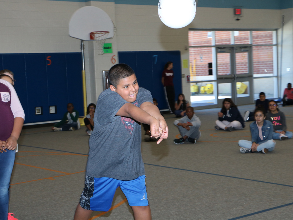 
Samuel Moreno shows off his bumping skills when Whitney Moffit, assistant volleyball coach for Lee College, stopped by Bañuelos Elementary to talk to students about volleyball skills.

