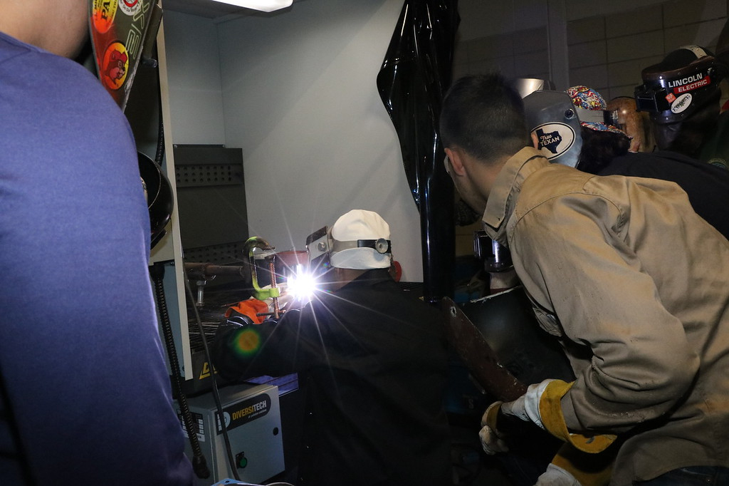 
Stuart Career Center welding students watch Hjalmar Aguilo, a welder and welding instructor who creates YouTube videos, demonstrate the technique of back feeding.
