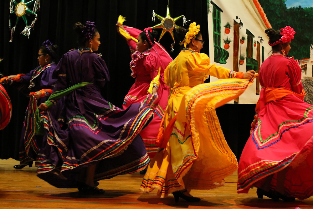  Anayeli Campos, Alexandra Olivera, Natally Razo, Lucero Hernandez and Yahaira Gomez, fifth-graders at Carver Elementary, dance during the school’s Cinco de Mayo celebration.
