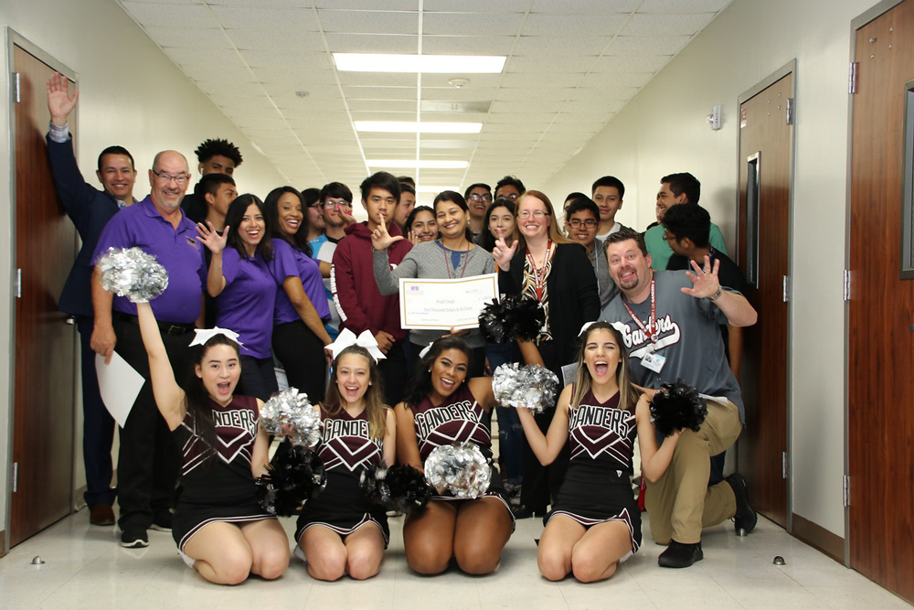 
Anjali Singh, who teaches Engineer Your World in the Robert E. Lee High School STEM Academy, celebrates with students in her class, Goose Creek CISD Education Foundation members and district administrators after the Foundation funds her grant, “Engineer Your World,” with a check for $1,000.
