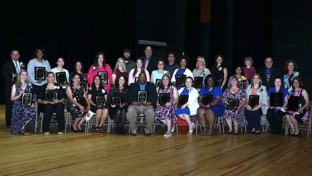 
Goose Creek CISD Campus Teachers of the Year, the District HAABE Bilingual/ESL Teacher of the Year and HAABE Secondary ESL Teacher of the Year, and the James Becker Thomson Special Education Teacher of the Year show their awards during the recent Retiree and Teacher of the Year Gala, “Master Chefs of Student Success.”
