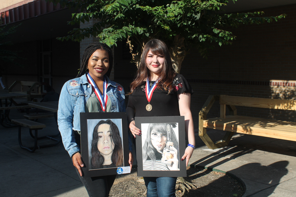 
Robert E. Lee High School art students medaled at the recent State Visual Arts Scholastic Event (VASE) art competition. Pictured are Rnae’sha Smith, state medalist for “Angelic Façade,” and Jennifer Pena, state medalist for “Asteria.”
