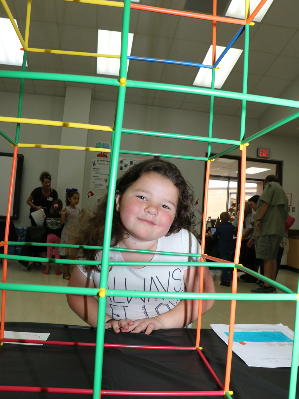 
Kenzie Robinson shows off a building she created at the GATE Showcase at Bonnie P. Hopper Primary.
