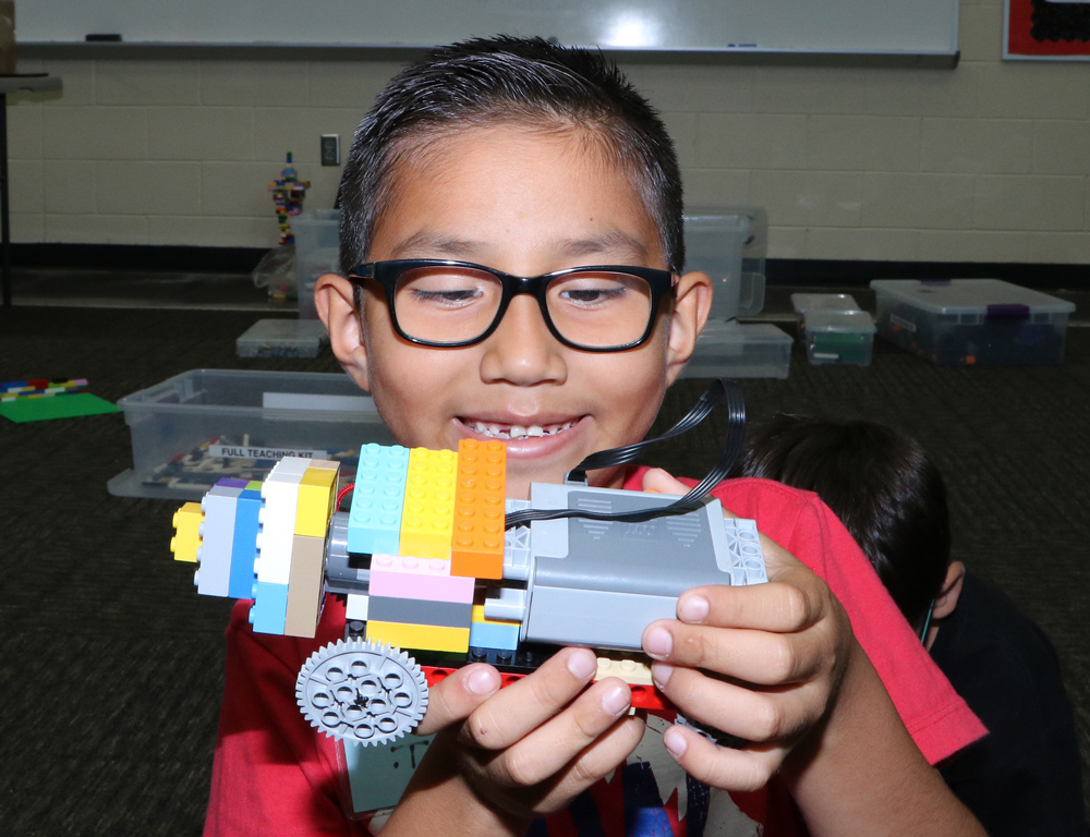 
Emanuel Tello, who just finished kindergarten at Dr. Johnny T. Clark, Jr. Elementary School, shows off his creation at Goose Creek CISD’s Lego-Inspired Engineering Camp at goose Creek Memorial High School.
