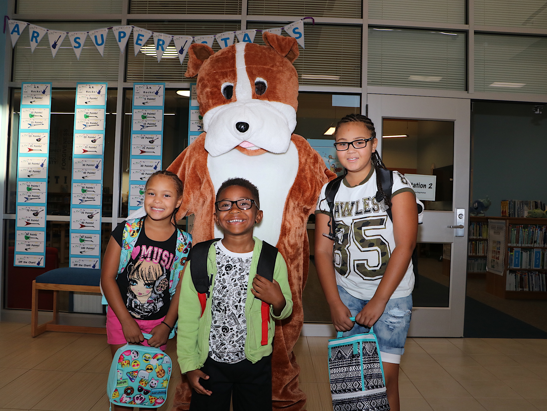  (from left) Annecia Driver, 2nd grade; Malike Rivera, Jr., kindergarten, and Dalecia Driver, fourth grade. 