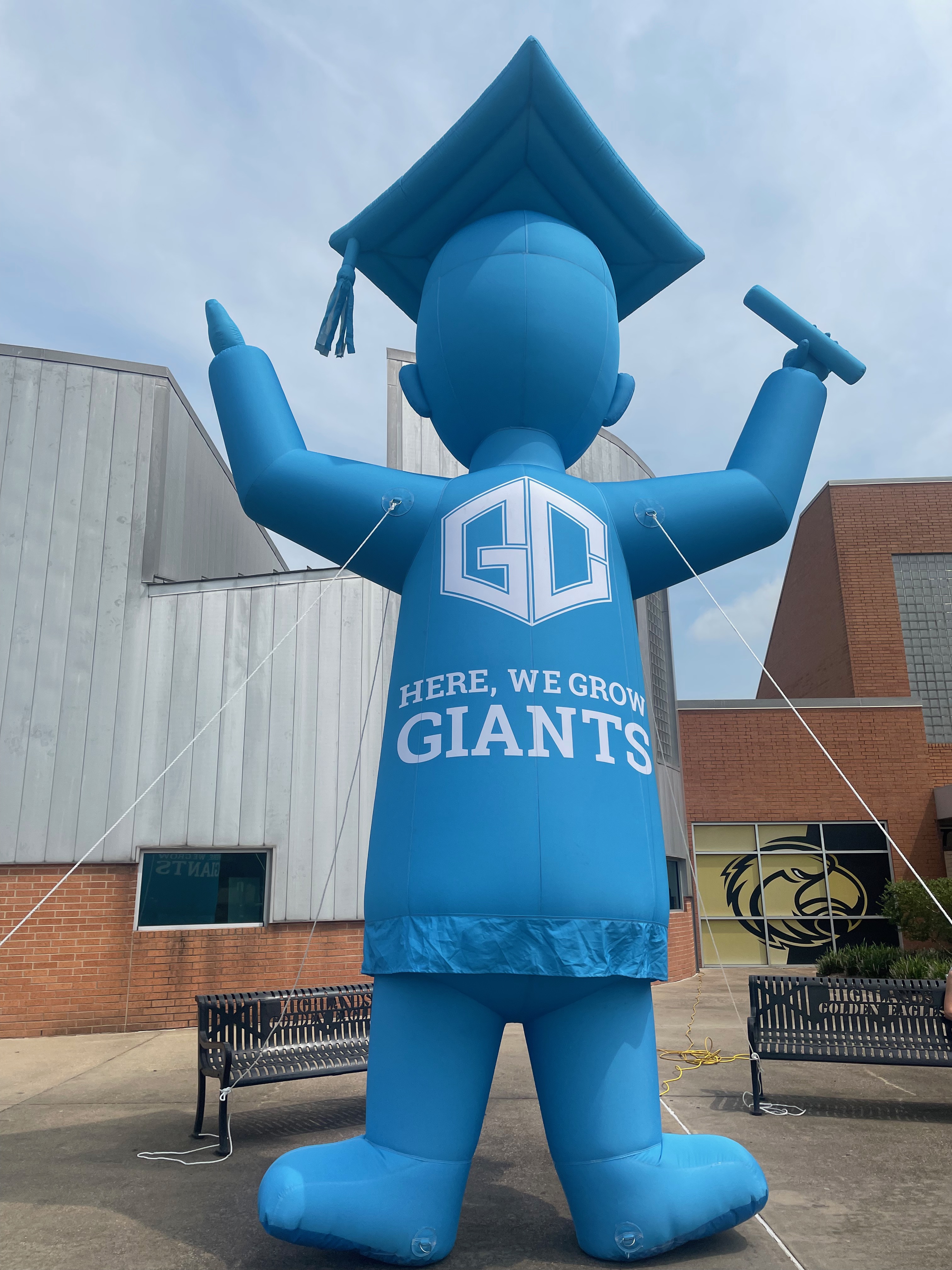 giant blue inflatable giant in front of highlands junior