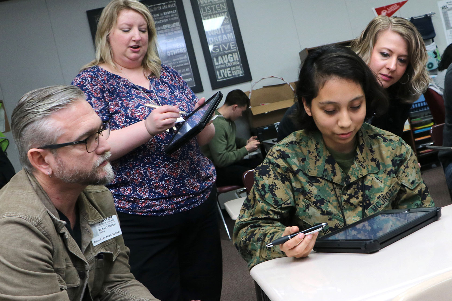 Student shows board member how Classkick App works.