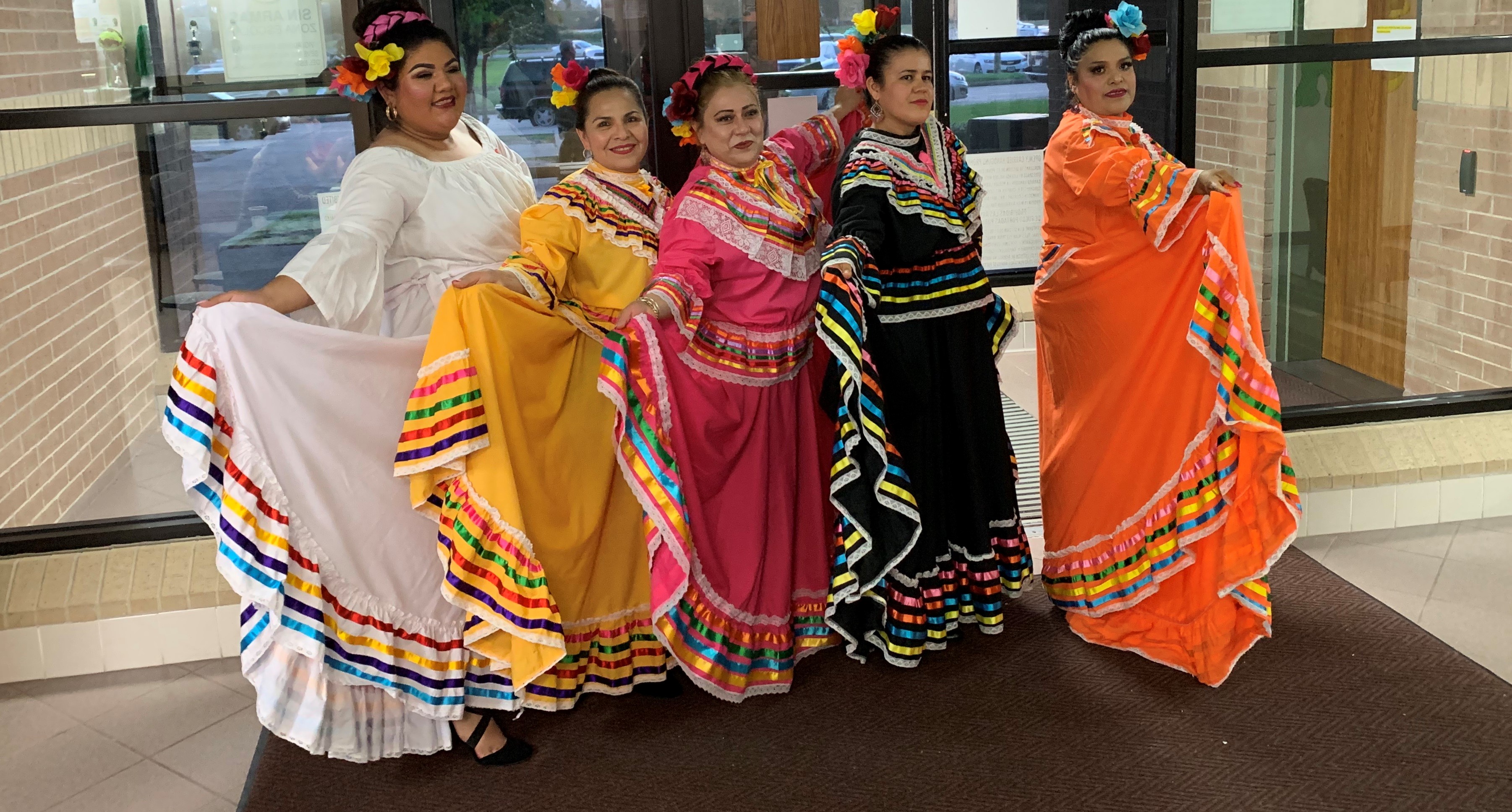 Community members (from left) Paola Castillo, Leticia Serrano, Yenedith Reynoso, Esther Huerta and Maria Manzares performed a baile folklórico during Hispanic Heritage Night at Horace Mann Junior School.