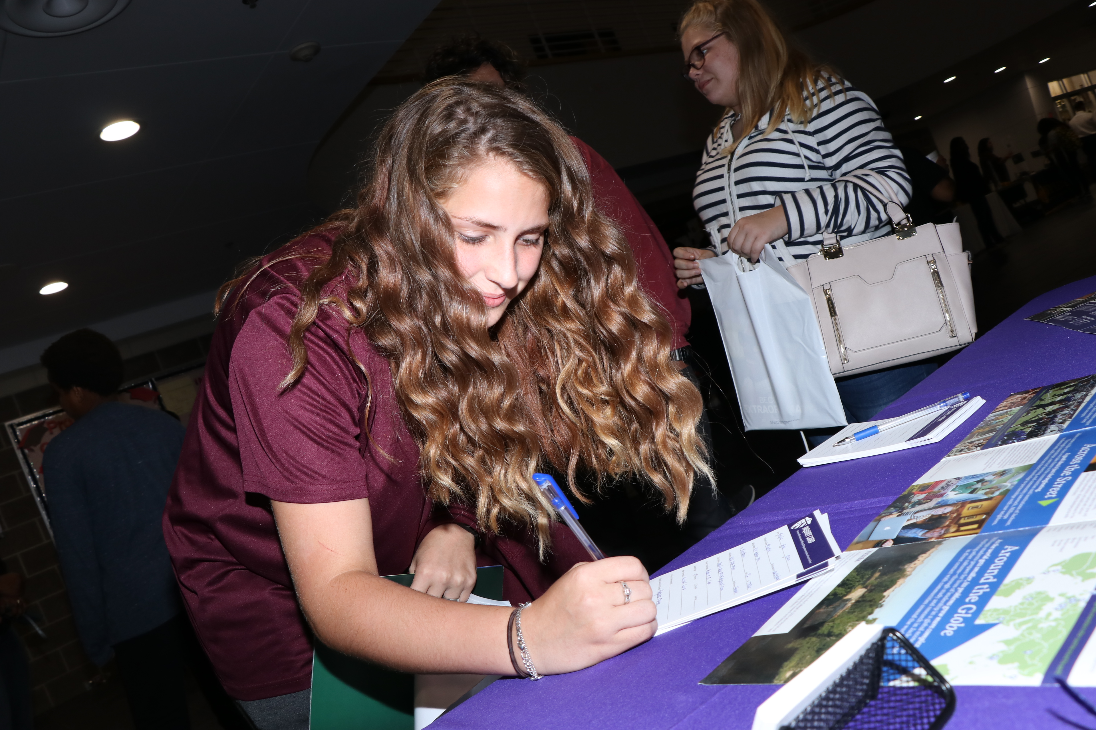 Baylee Dixon, a freshman at Robert E. Lee High School, signs up for information about Millsaps Colle