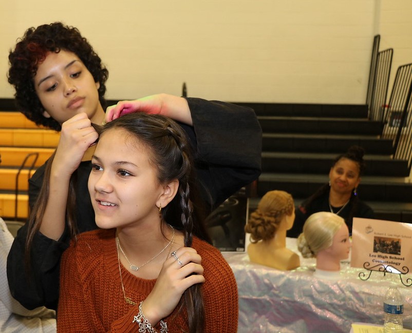 Student has hair braided by Lee Cosmetology Student.