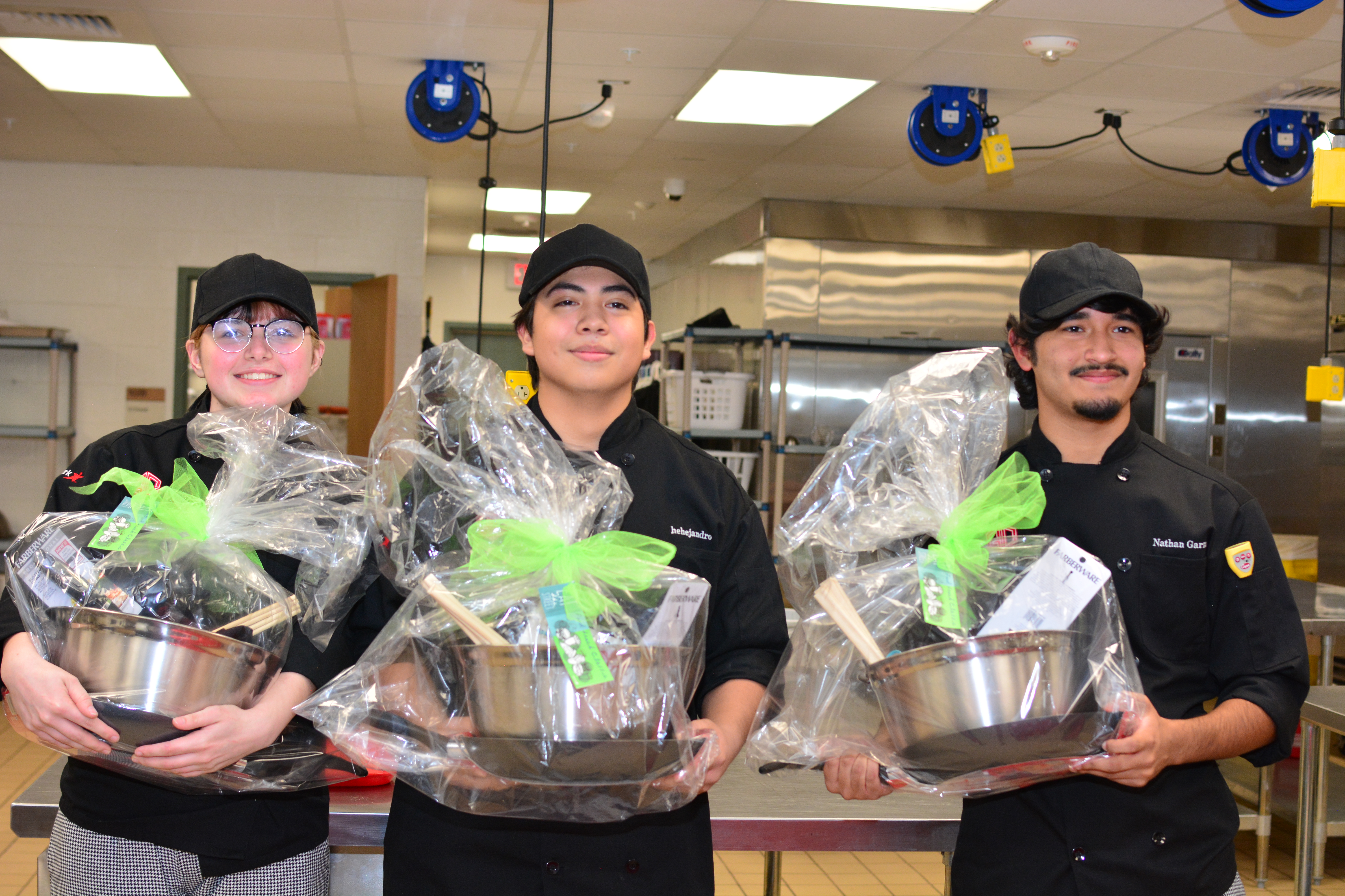 culinary students pose with gift baskets