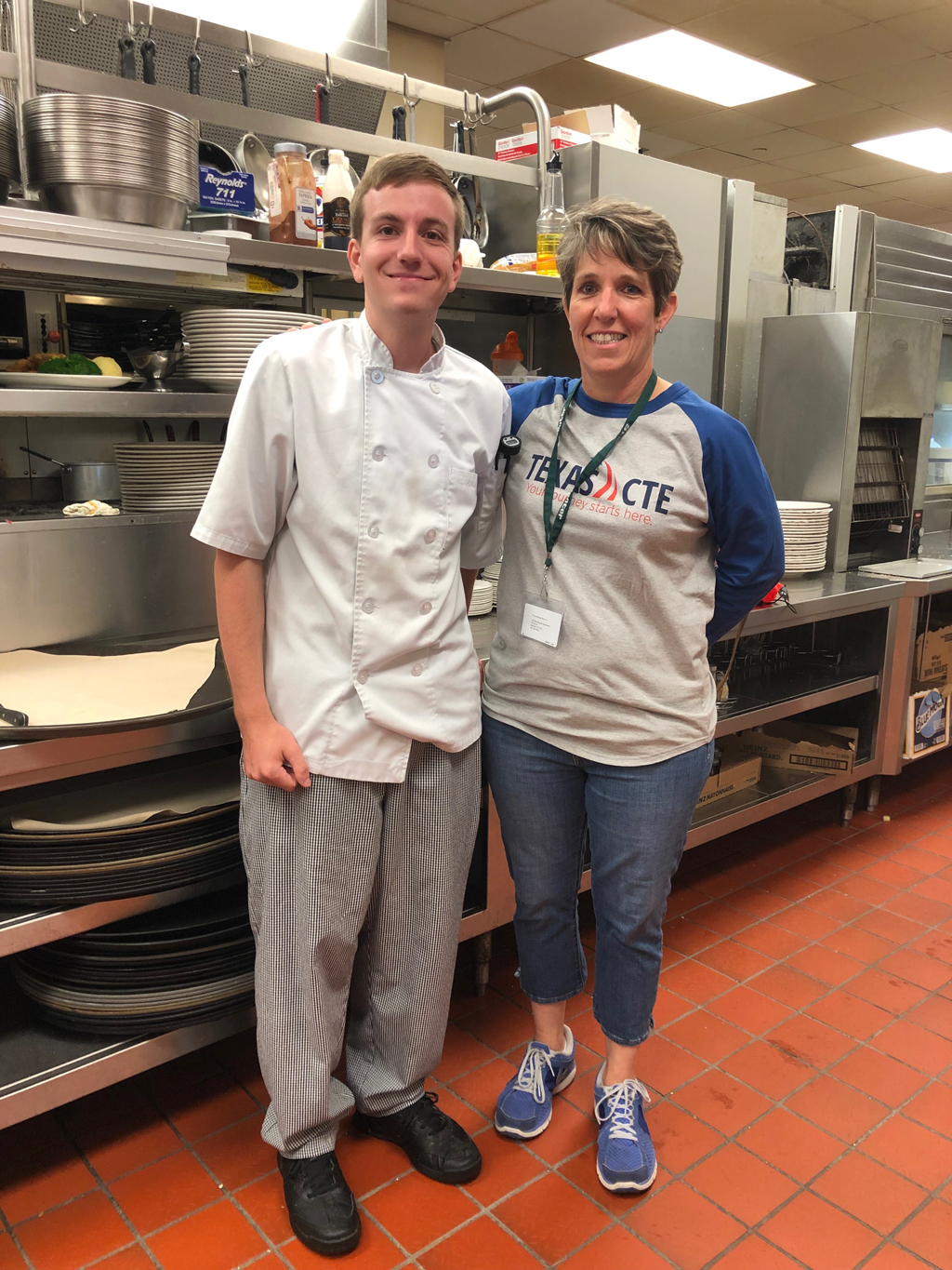 
Chef Tina Andrade (right) visits with her former culinary arts student Christopher Toppeto at Shearn’s Seafood and Prime Steaks at Moody Gardens in Galveston, where he works as a sous-chef.
