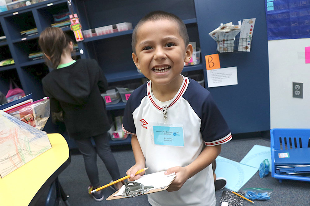 
Miguel Gonzalez-Castillo searches for his station during an activity in the kindergarten Dual Language Two-Way Program at Carver Elementary.
