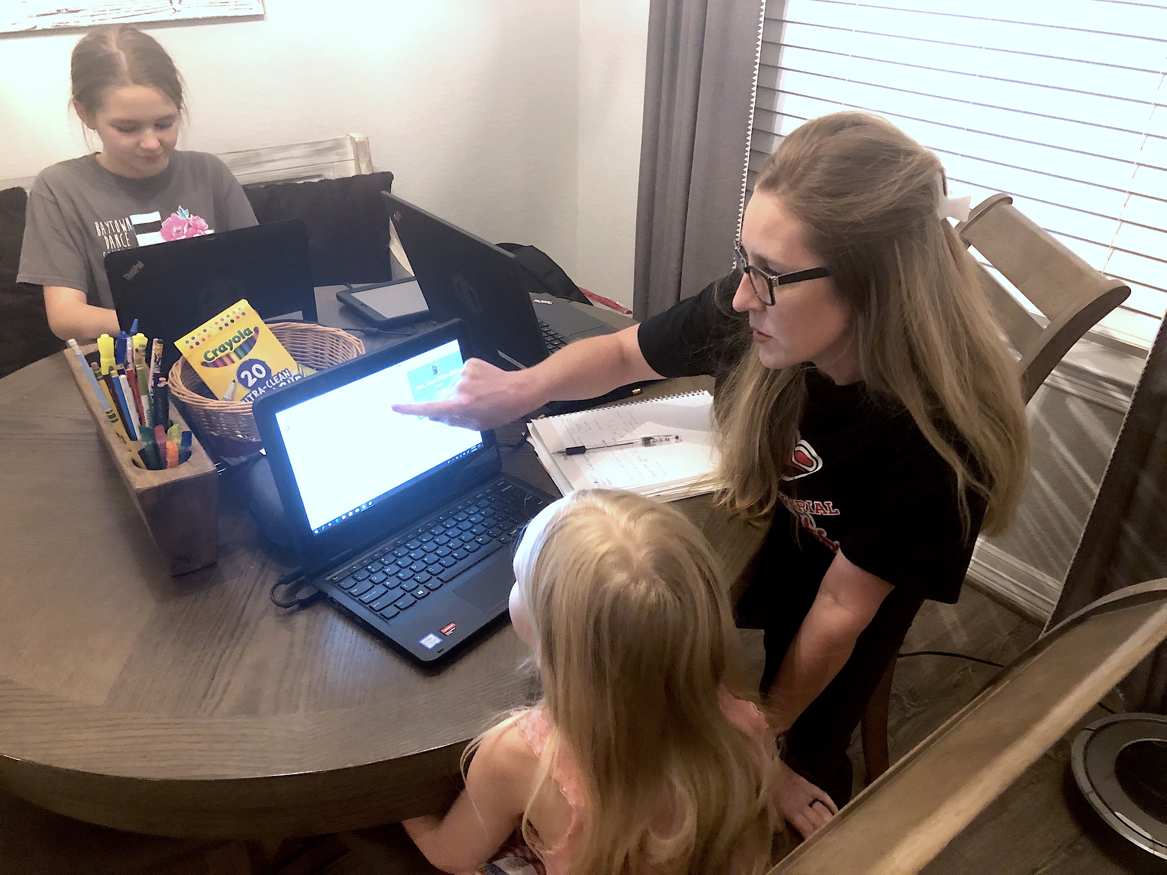 Johnson helping her child with school  work