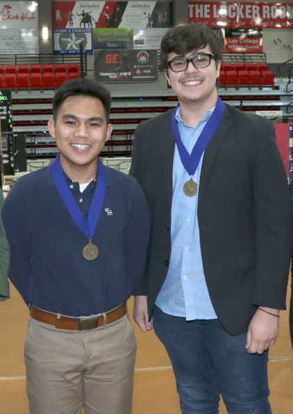 Guzman and Rupp pose for photo with medals