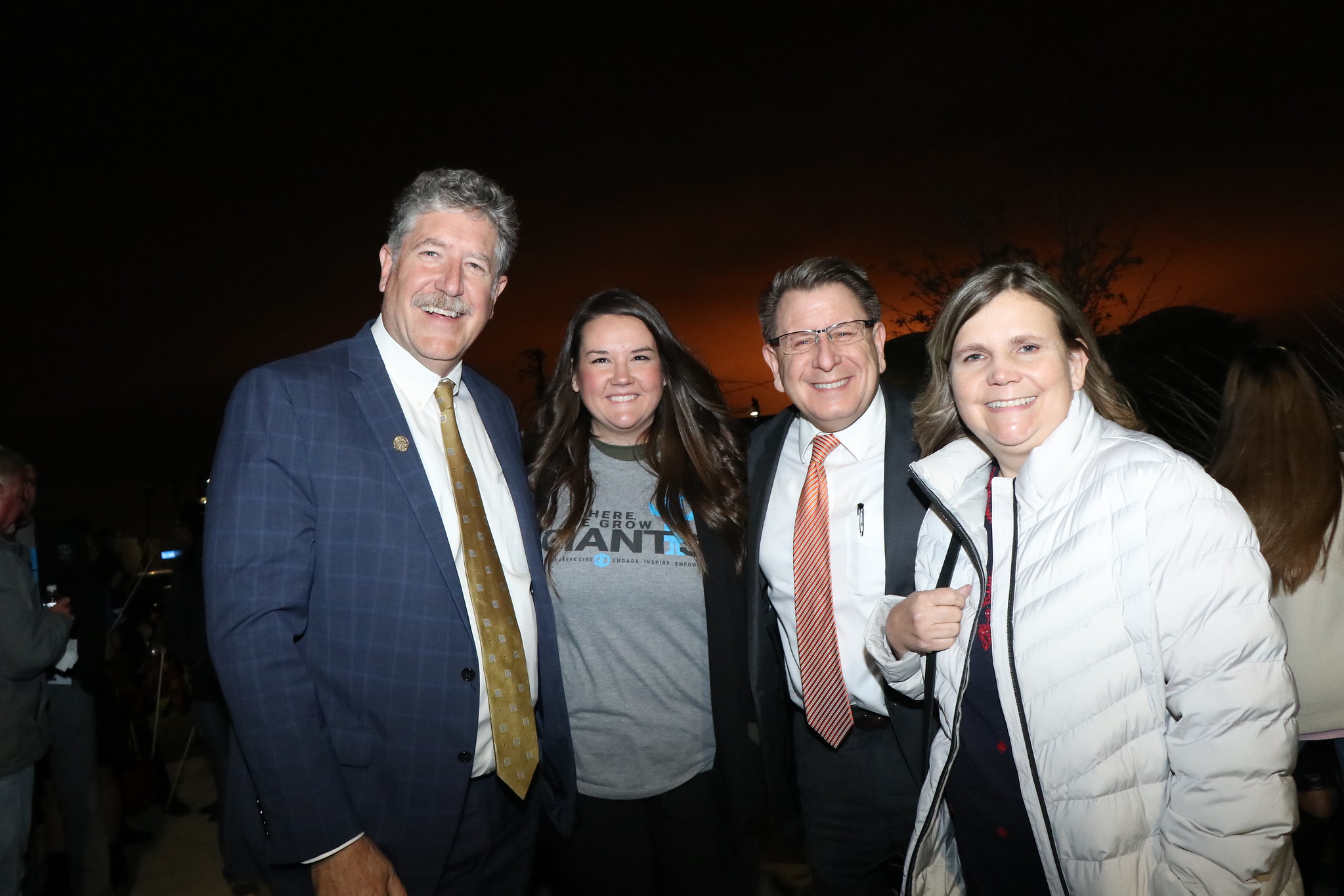 Superintendent poses with community and district members