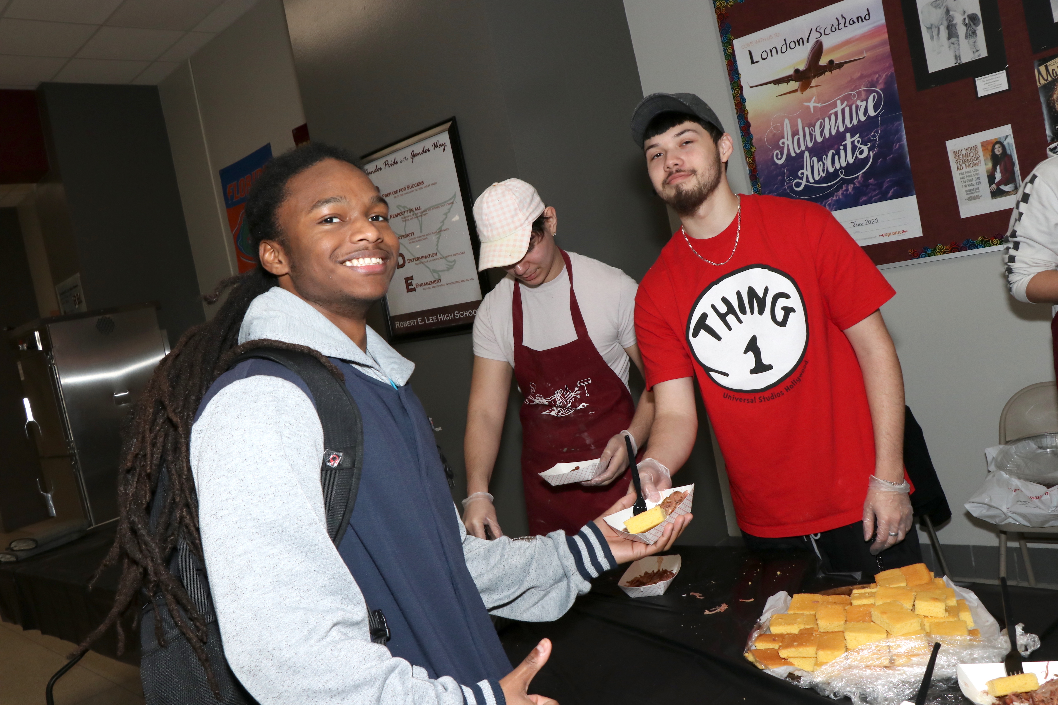 Student is served food by other students