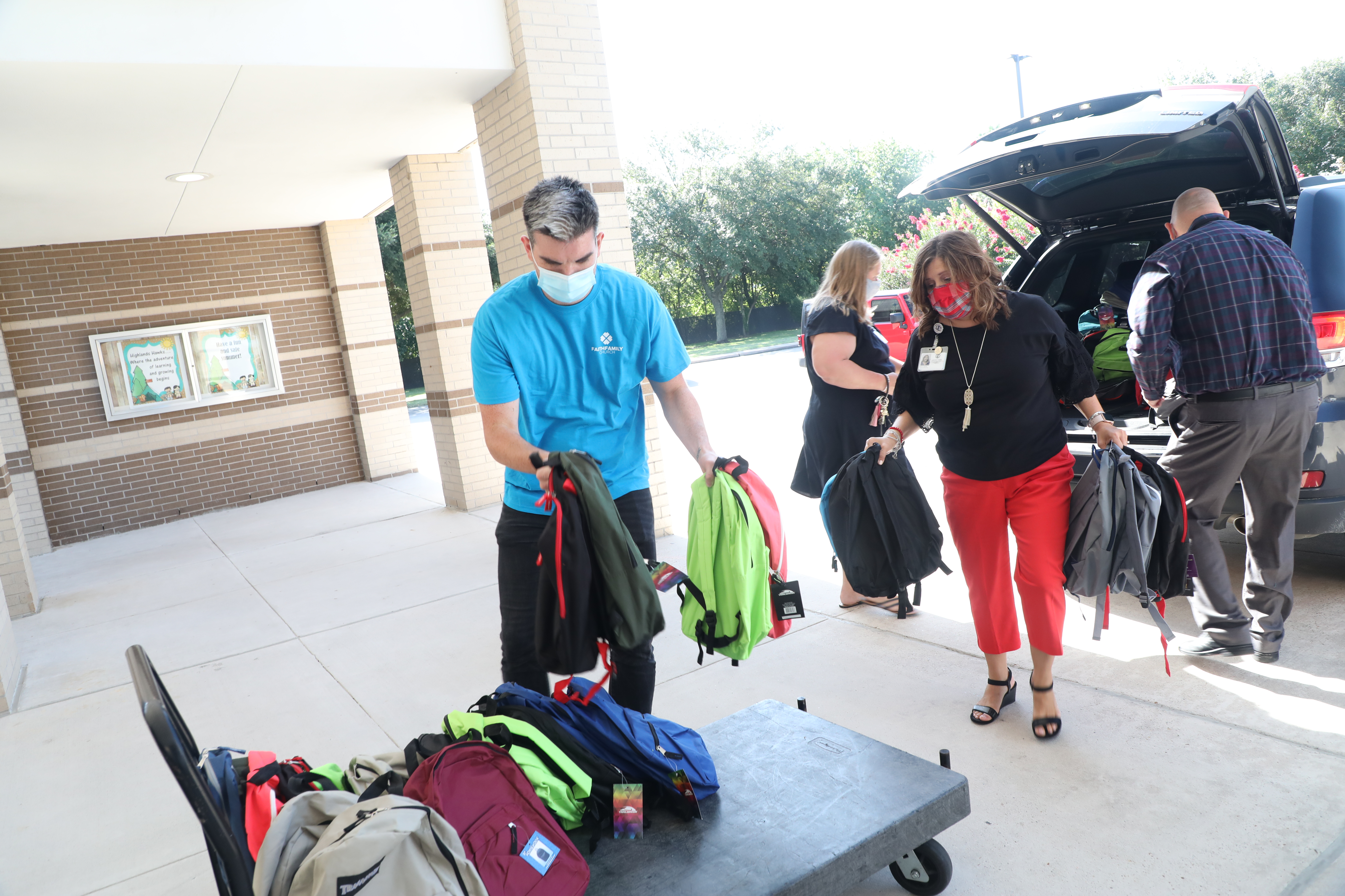 Faith Family Church unloading backpacks